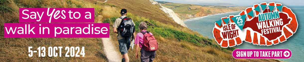 Couple walking along the coastal path on the Isle of Wight